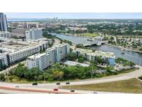 Stunning aerial view showcasing the condo buildings, the river, and the downtown skyline at 201 W Laurel St # 307, Tampa, FL 33602