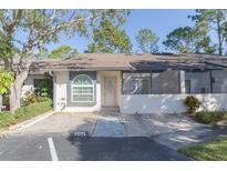 Charming single-story villa with a well-maintained front yard and covered entry at 3777 Mission Ct, Largo, FL 33771