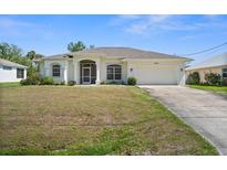 Charming single-story home featuring a well-maintained lawn and attached two-car garage at 4538 Appleton Ter, North Port, FL 34286
