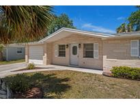 Charming single-story home with well-maintained brick facade and attached garage at 4619 Irene Loop, New Port Richey, FL 34652