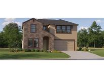 Inviting two-story home featuring stone accents, a two-car garage, and a well-manicured lawn at 9328 Gladsome Dr, Land O Lakes, FL 34637
