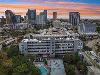 Stunning aerial view showcasing the building's architecture and downtown skyline at sunset at 201 Laurel # 308, Tampa, FL 33602