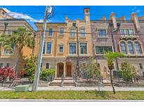 Charming townhome with stone accents and a landscaped front yard, perfect for curb appeal at 2226 Soho Bay Ct, Tampa, FL 33606
