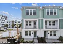 Inviting townhouse with two stories, and charming balconies. Featuring modern architecture and landscaping at 445 31St N Way, St Petersburg, FL 33713