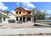 Two-story home under construction with blue sky and scattered clouds in the background at 5001 21St N Ave, St Petersburg, FL 33710