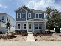 Charming two-story home featuring a stone accent facade, well-manicured lawn and tasteful landscaping at 5001 21St N Ave, St Petersburg, FL 33710