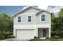 Charming two-story home with gray siding, white trim, and an attached garage at 12440 Gust Ct, Hudson, FL 34669