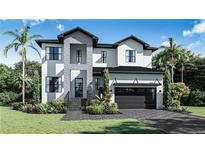 Beautiful two-story home featuring a stone facade and modern black trim, complemented by lush landscaping and a paved driveway at 4618 W Kensington Ave, Tampa, FL 33629