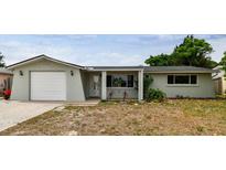 Charming single-story home with attached garage and well-maintained front yard at 5810 8Th Ave, New Port Richey, FL 34652
