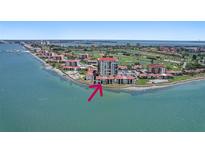 Waterfront condo community, featuring a scenic view of the coastline and surrounding buildings at 6265 Sun Blvd # 107, St Petersburg, FL 33715