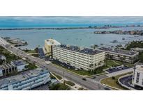 Stunning aerial view of waterfront condos with scenic bay and city views at 100 Bluff View Dr # 510A, Belleair Bluffs, FL 33770