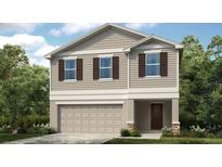Charming two-story home featuring neutral siding, a two-car garage and a welcoming entryway, creating curb appeal at 12406 Gust Ct, Hudson, FL 34669