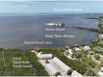 Desirable waterfront condos feature a kayak launch, natural beach area, and panoramic bay views of Sunset Beach at 1500 Sunset Rd # C7, Tarpon Springs, FL 34689