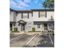 Charming two-story townhouse with neutral siding, dark shutters, and well-maintained landscaping at 4332 Har Paul Cir, Tampa, FL 33614