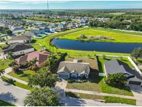 Charming single-Gathering home with a beautiful lake view and lush landscaping at 10540 Carloway Hills Dr, Wimauma, FL 33598