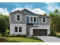 Charming two-story home boasts a modern design and inviting curb appeal at 14433 Meadow Bird Ave, Riverview, FL 33579