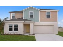 Two-story home featuring neutral-colored siding, attached two-car garage, and well-manicured lawn at 14789 Summer Branch Dr, Lithia, FL 33547