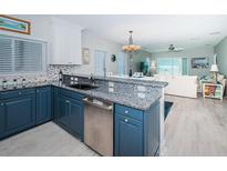 Updated kitchen featuring granite countertops and modern stainless steel appliances at 3 7Th Ave # 3, Indian Rocks Beach, FL 33785