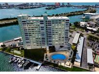 Stunning aerial view of waterfront condo with boat slips and pool overlooking beautiful bay views at 31 Island Way # 609, Clearwater Beach, FL 33767
