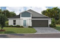 Charming single-Gathering home with a well-manicured lawn and a paved driveway at 37035 Sagemoor Dr, Zephyrhills, FL 33541
