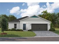 Charming single-story home featuring a two-car garage, well-manicured lawn, and modern architectural details at 37049 Sagemoor Dr, Zephyrhills, FL 33541