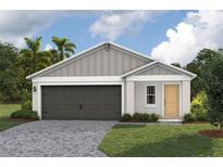 Charming single-story home with a two-car garage, landscaped yard, and neutral paint scheme at 37171 Sagemoor Dr, Zephyrhills, FL 33541
