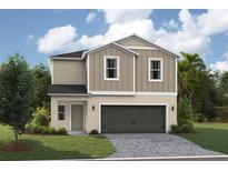Charming two-story home featuring a two-car garage and neutral color palette at 37198 Sagemoor Dr, Zephyrhills, FL 33541