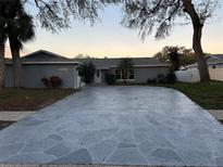Charming single-story home featuring a spacious driveway and well-maintained landscaping at 11096 117Th Way, Seminole, FL 33778