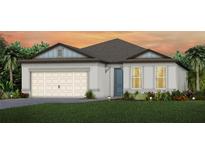 Charming single-story home with a neutral color scheme and attached two-car garage at 11447 Shoreline Trl, Parrish, FL 34219