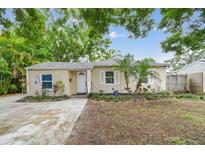 Charming single-story home with a well-manicured front yard, lush landscaping, and a freshly painted exterior at 130 41St Ne Ave, St Petersburg, FL 33703