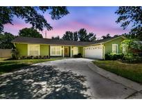 Charming single-story home with well-maintained landscaping and a spacious driveway at 4161 Rolling Springs Dr, Tampa, FL 33624