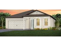 Charming single-story home with a two-car garage, manicured lawn, and inviting entrance at 10317 Cross River Trl, Parrish, FL 34219