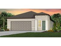 Charming single-story home with a neutral color palette, attached garage, and well-manicured front lawn at 10414 Cross River Trl, Parrish, FL 34219