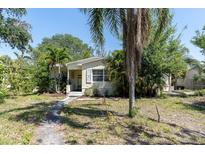 Charming single-story home surrounded by mature trees and lush landscaping at 627 38Th Ne Ave, St Petersburg, FL 33704