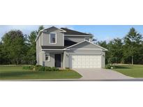 Charming two-story home with a well-manicured lawn and a two-car garage at 11738 Brae Way, Dade City, FL 33525