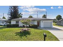 Charming single-story home with a well-maintained lawn and inviting curb appeal at 1979 E Skyline Dr, Clearwater, FL 33763