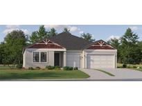 Charming single-story home with a two-car garage and well-maintained lawn, ideal for comfortable living at 22075 Storybook Cabin Way, Land O Lakes, FL 34637