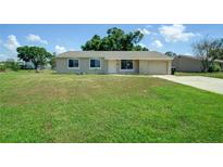 Charming single-story home with a well-maintained lawn and attached one car garage at 3262 Montclair Cir, North Port, FL 34287