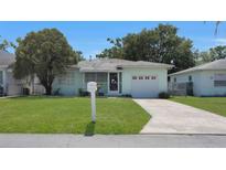 Charming home with a well-maintained lawn, a mailbox, and a single-car garage at 5000 18Th S Ave, Gulfport, FL 33707
