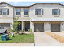 Charming townhome exterior with a well-maintained lawn and a private garage at 14323 Easy Goer St, Ruskin, FL 33573