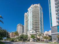 Luxury high-rise condominium building featuring multiple balconies and city views under a clear blue sky at 450 Knights Run Ave # 414, Tampa, FL 33602