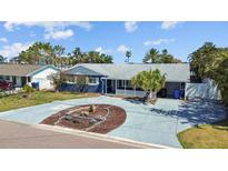 Charming single-story home features a well-manicured yard, inviting curb appeal, and a spacious driveway at 7919 Causeway S Blvd, St Petersburg, FL 33707