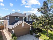 Beautiful two-story home with a two-car garage and well-manicured landscaping at 12215 Adventure Dr, Riverview, FL 33579