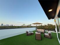 Relaxing rooftop deck featuring outdoor seating and artificial turf with city views at 2112 4Th S St, St Petersburg, FL 33705