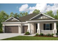 Charming single-story home featuring a two-car garage and a welcoming front porch at 3407 Lumber Falls Dr, Plant City, FL 33565