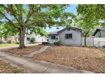 Charming single-story home featuring mature trees and a cozy front yard in a quiet neighborhood setting at 4102 Haines N Rd, St Petersburg, FL 33703