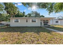 Charming single-story home with a well-maintained lawn and cozy front porch at 5302 S Himes Ave, Tampa, FL 33611