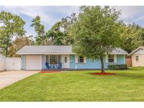 Charming home featuring a well-manicured lawn and appealing curb appeal with a freshly painted exterior at 2616 Fairway S Ave, St Petersburg, FL 33712