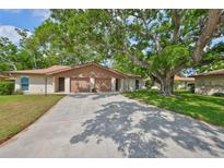 Charming single-story home with a two-car garage and mature trees providing shade at 5108 26Th Street W Ct, Bradenton, FL 34207