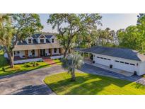 Beautifully landscaped home with a detached garage and convenient covered parking at 8013 Linesider Dr, Riverview, FL 33578